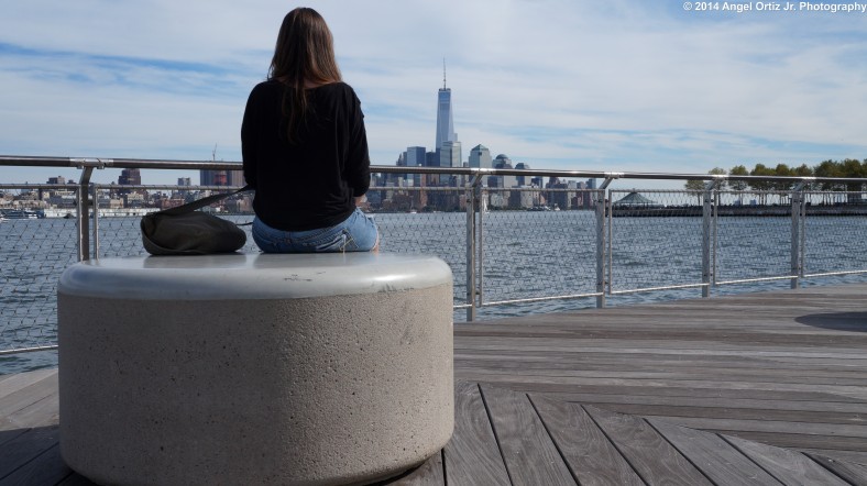 Chloe looking like a traveler once again as she looks on the Manhattan skyline  © 2014 Angel Ortiz Jr. Photography