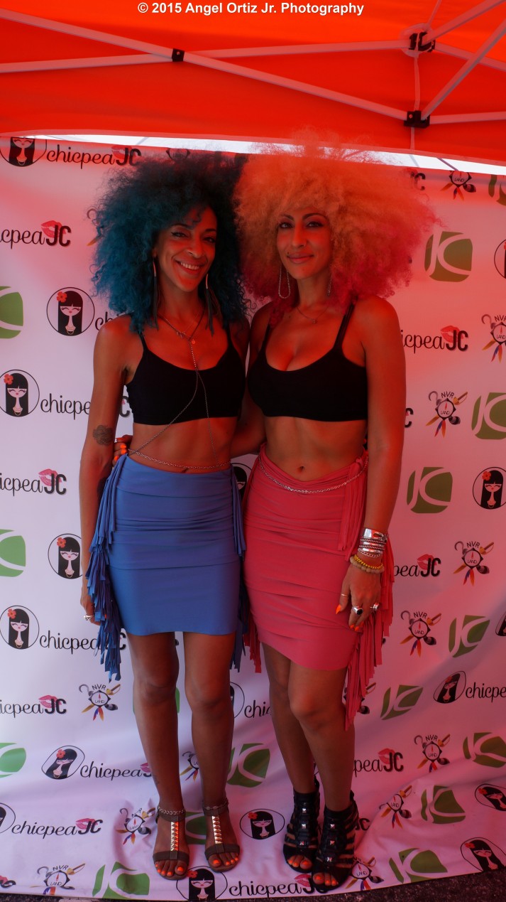 Vertical shot of The Big Hair Girls (Lizzy and Venus) inside ChicpeaJC's booth sporting their unique outfits and rocking their big hair © 2015 Angel Ortiz Jr. Photography