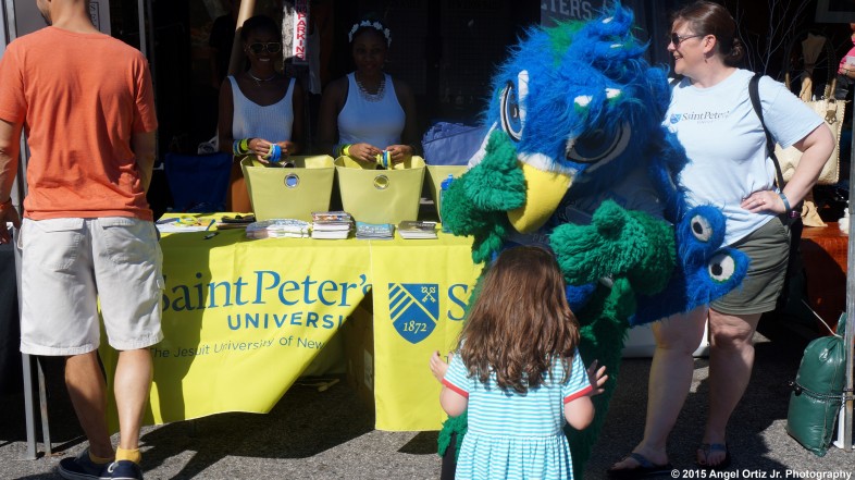 The St. Peter's Mascot ready to embrace a hug from a sweet child  © 2015 Angel Ortiz Jr. Photography